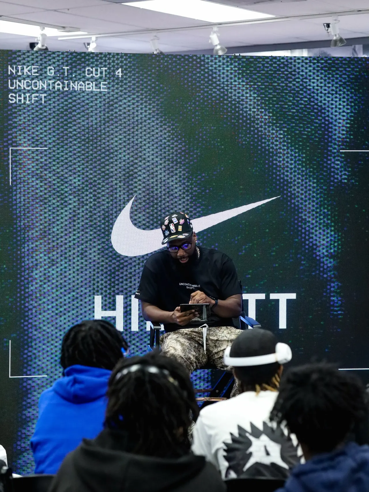 Photo by Tampa-Based Photographer on April 14, 2026. May be an image of standing, microphone, sportswear and crowd.